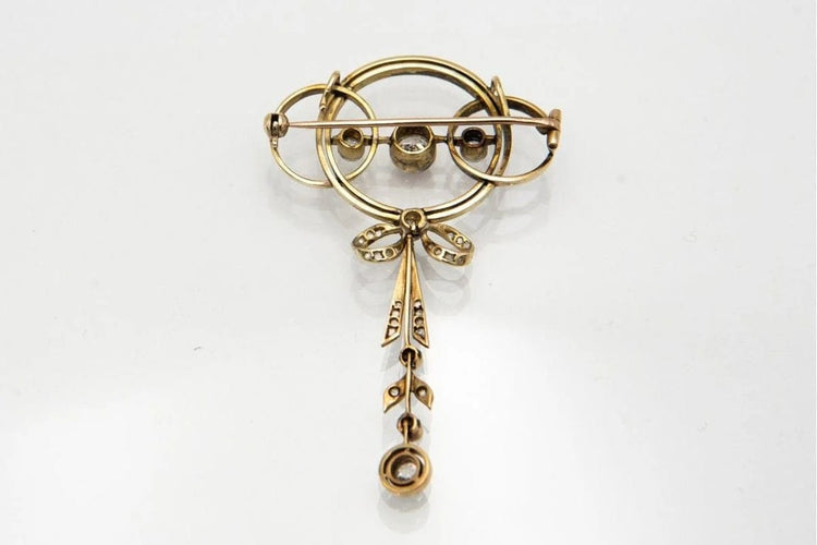 Broche Broche Art déco ancienne en or jaune et platine avec diamants 58 Facettes 9456