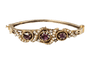 Bracelet Bracelet rigide ancien en or jaune 14 carats avec rubis, perles et diamants 58 Facettes 10673