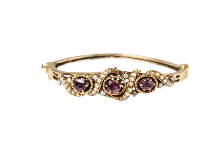 Bracelet Bracelet rigide ancien en or jaune 14 carats avec rubis, perles et diamants 58 Facettes 10673