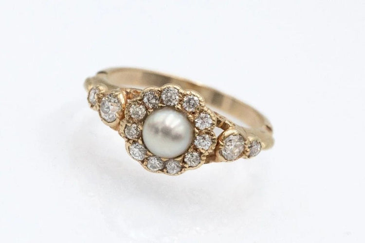 Bague 52 Bague marguerite en or jaune 14 carats, perle et diamants 58 Facettes 11481