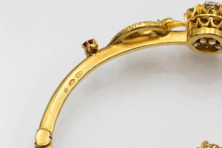 Bracelet Bracelet ancien motif phénix en or jaune 14 carats, rubis et diamants 58 Facettes 11397