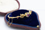 Bracelet Bracelet ancien motif phénix en or jaune 14 carats, rubis et diamants 58 Facettes 11397