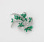 Broche Broche en or blanc 750 avec émeraudes et diamants 58 Facettes