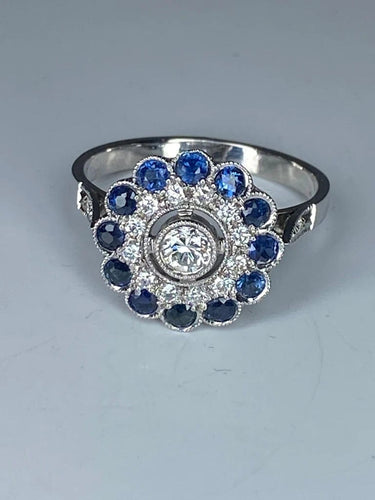 Bague 57 Bague fleur Art déco en or 18 ct, diamants et saphirs 58 Facettes AB45