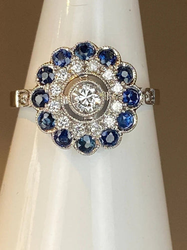 Bague 57 Bague fleur Art déco en or 18 ct, diamants et saphirs 58 Facettes AB45