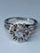 Bague 63 Bague fleur en or blanc 18 carats et diamants 58 Facettes AB60