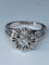 Bague 63 Bague fleur en or blanc 18 carats et diamants 58 Facettes AB60