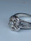 Bague 63 Bague fleur en or blanc 18 carats et diamants 58 Facettes AB60