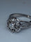 Bague 63 Bague fleur en or blanc 18 carats et diamants 58 Facettes AB60