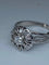 Bague 63 Bague fleur en or blanc 18 carats et diamants 58 Facettes AB60
