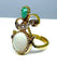 Bague 56 Bague en or jaune et or blanc 18 carats, opale, émeraude et diamants 58 Facettes AB226