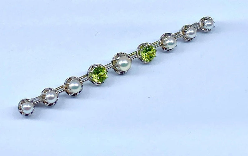 Broche Broche barrette en or 18 carats et platine, perles et péridots 58 Facettes AB275