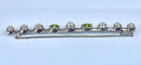 Broche Broche barrette en or 18 carats et platine, perles et péridots 58 Facettes AB275