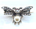 Broche Broche mouche en or 18 carats et argent, perle fine et diamants 58 Facettes AB298