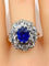 Bague 57 Bague marguerite en or blanc 18 carats et platine, saphir et diamants 58 Facettes AB347