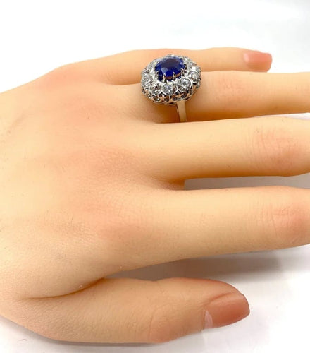Bague 57 Bague marguerite en or blanc 18 carats et platine, saphir et diamants 58 Facettes AB347
