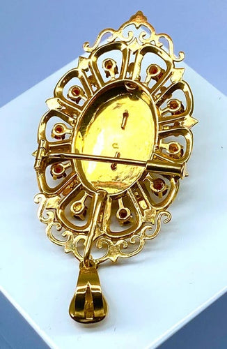 Pendentif Broche pendentif en or 18 carats aux grenats, émeraude et diamants 58 Facettes A 397