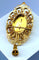 Pendentif Broche pendentif en or 18 carats aux grenats, émeraude et diamants 58 Facettes A 397