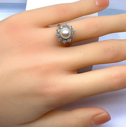 Bague 49 Bague marguerite en or blanc 18 carats et platine, perle et diamants 58 Facettes AB456