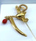 Broche Broche épingle de cravate « Épée » en or jaune 18 carats et pierres rouges 58 Facettes AB524
