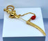 Broche Broche épingle de cravate « Épée » en or jaune 18 carats et pierres rouges 58 Facettes AB524