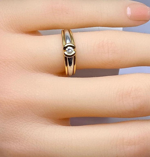 Bague 50 Bague solitaire en or jaune et or blanc 18 carats et diamant 58 Facettes AB556