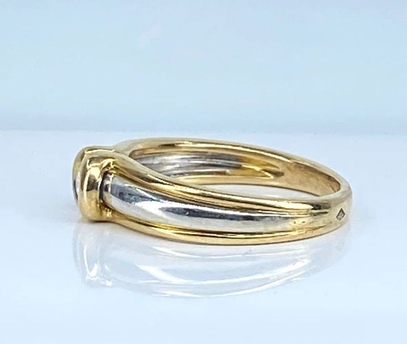 Bague 50 Bague solitaire en or jaune et or blanc 18 carats et diamant 58 Facettes AB556