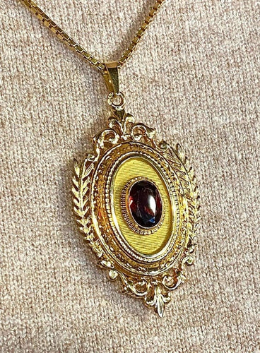 Pendentif Pendentif porte-souvenir ouvrant en or 18 carats et grenat 58 Facettes AB574