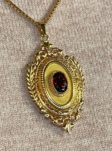 Pendentif Pendentif porte-souvenir ouvrant en or 18 carats et grenat 58 Facettes AB574