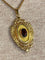 Pendentif Pendentif porte-souvenir ouvrant en or 18 carats et grenat 58 Facettes AB574