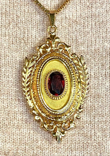 Pendentif Pendentif porte-souvenir ouvrant en or 18 carats et grenat 58 Facettes AB574
