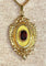 Pendentif Pendentif porte-souvenir ouvrant en or 18 carats et grenat 58 Facettes AB574