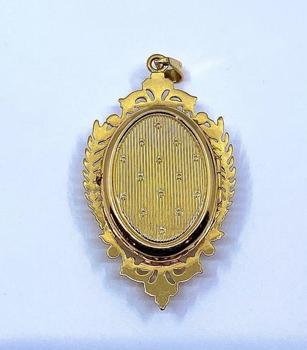 Pendentif Pendentif porte-souvenir ouvrant en or 18 carats et grenat 58 Facettes AB574