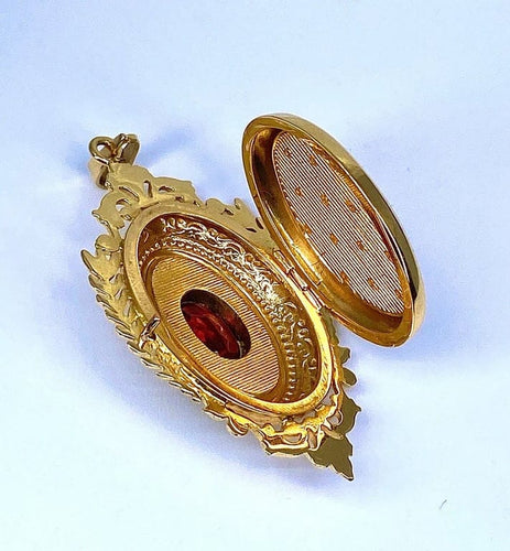Pendentif Pendentif porte-souvenir ouvrant en or 18 carats et grenat 58 Facettes AB574