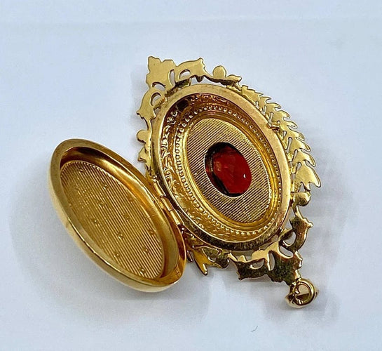 Pendentif Pendentif porte-souvenir ouvrant en or 18 carats et grenat 58 Facettes AB574