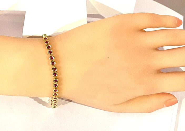 Bracelet Bracelet ligne en or jaune 18 carats et rubis 58 Facettes AB609