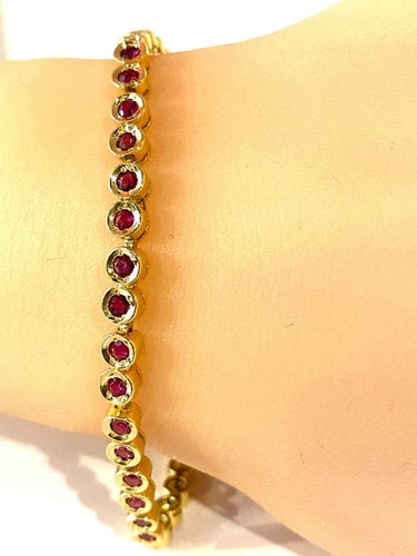 Bracelet Bracelet ligne en or jaune 18 carats et rubis 58 Facettes AB609