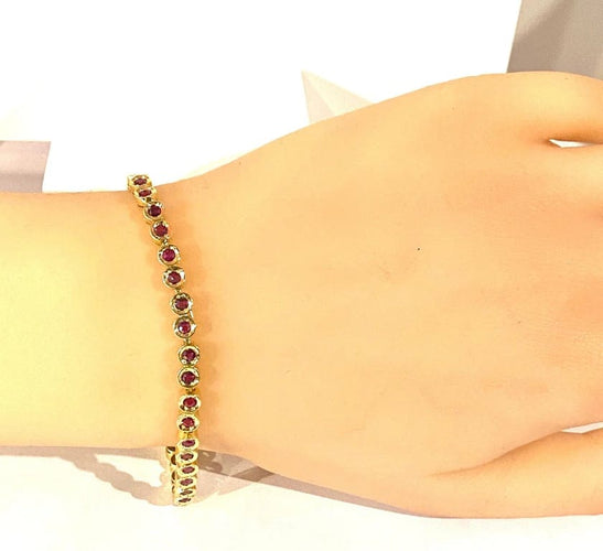 Bracelet Bracelet ligne en or jaune 18 carats et rubis 58 Facettes AB609