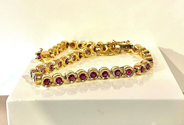 Bracelet Bracelet ligne en or jaune 18 carats et rubis 58 Facettes AB609