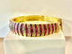 Bracelet Bracelet jonc ouvrant en or jaune 18 carats, rubis et diamants 58 Facettes AB608