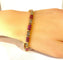 Bracelet Bracelet en or jaune 18 carats avec rubis calibrés et diamants 58 Facettes AB620