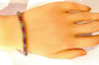 Bracelet Bracelet en or jaune 18 carats avec rubis calibrés et diamants 58 Facettes AB620