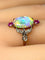 Bague 53 Bague en or jaune 18 carats à l’opale, diamants et rubis (vers 1900) 58 Facettes AB639