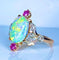 Bague 53 Bague en or jaune 18 carats à l’opale, diamants et rubis (vers 1900) 58 Facettes AB639