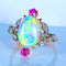 Bague 53 Bague en or jaune 18 carats à l’opale, diamants et rubis (vers 1900) 58 Facettes AB639