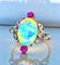 Bague 53 Bague en or jaune 18 carats à l’opale, diamants et rubis (vers 1900) 58 Facettes AB639