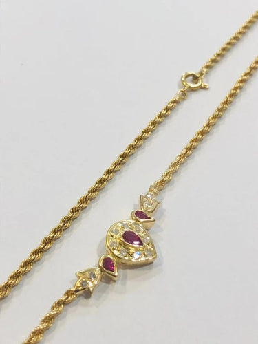 Collier Collier maille corde en or jaune 18 carats, rubis et diamants 58 Facettes