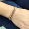 Bracelet Bracelet vintage en or jaune 18 carats avec rubis et diamants 58 Facettes BR99