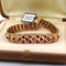 Bracelet Bracelet vintage en or jaune 18 carats avec rubis et diamants 58 Facettes BR99