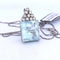 Pendentif Pendentif en or blanc 18 carats avec aigue-marine et diamants 58 Facettes CL43